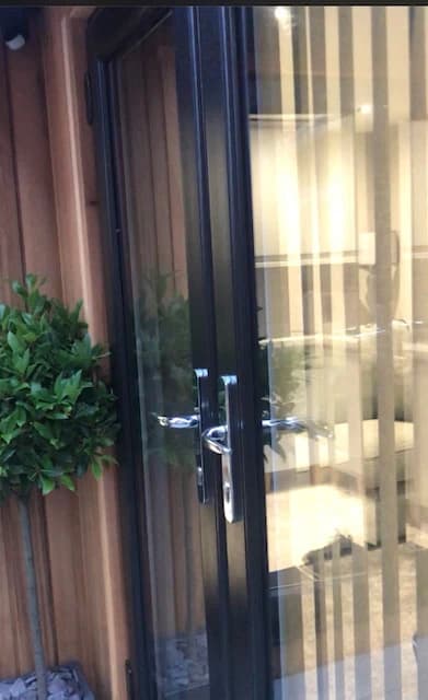 Close-up of the timber cladding and glazed door on Ian’s completed garden room